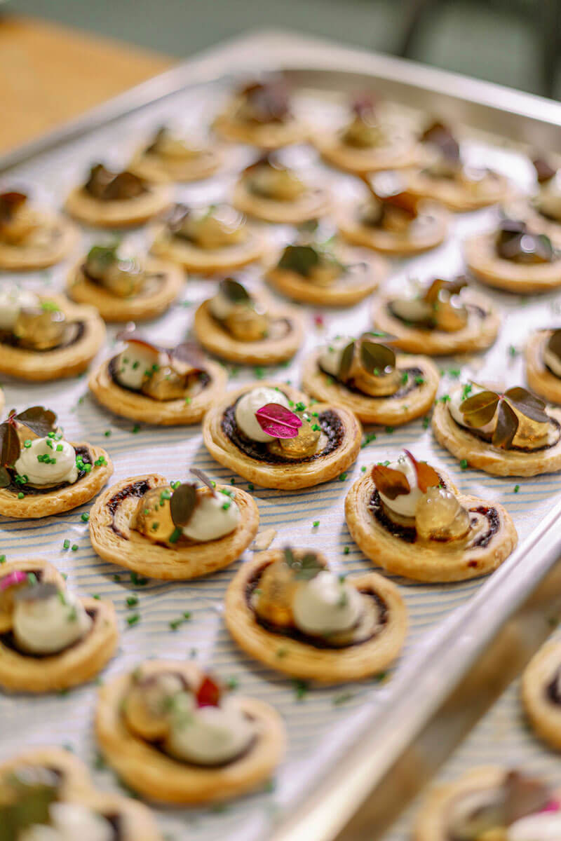 a tray of coclourful canapes on a silver tray ready for an event